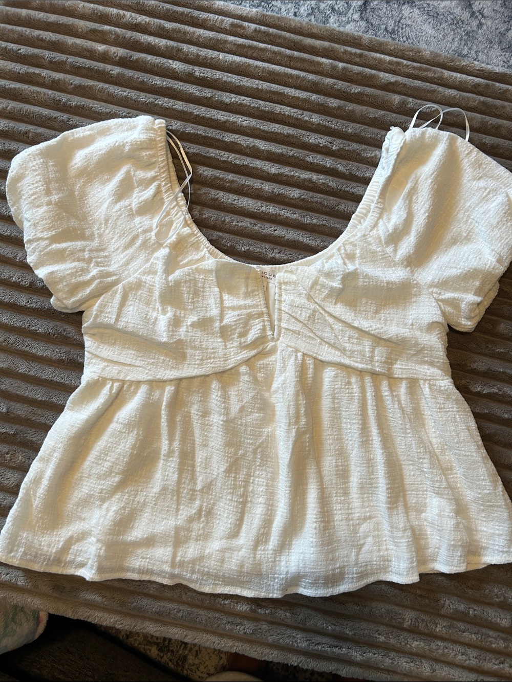 Textured White Puff-Sleeve Peplum Blouse